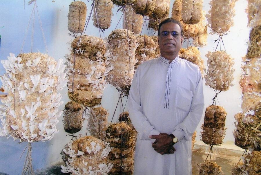 Founder with hanging mushroom bags